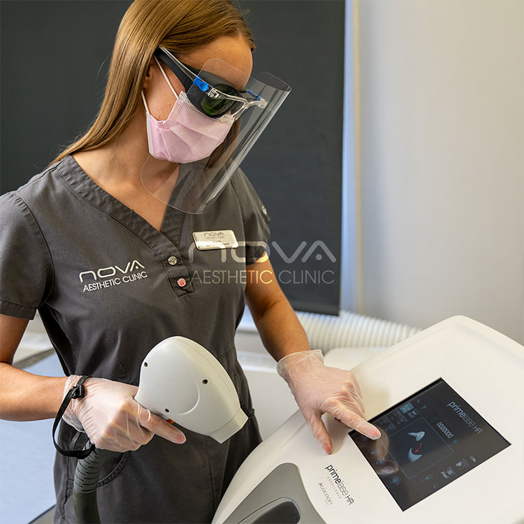 Senior aesthetic practitioner Agata, setting up the PrimeLase HR diode laser device for a laser hair removal procedure.